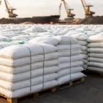 Global fertilizer supply with stacked urea bags at port amid rising fertilizer prices