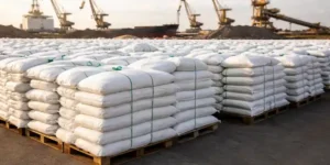 Global fertilizer supply with stacked urea bags at port amid rising fertilizer prices