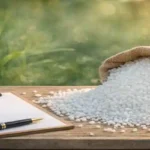 Urea fertilizer tender concept showing white urea granules with clipboard and pen representing global bidding and pricing analysis